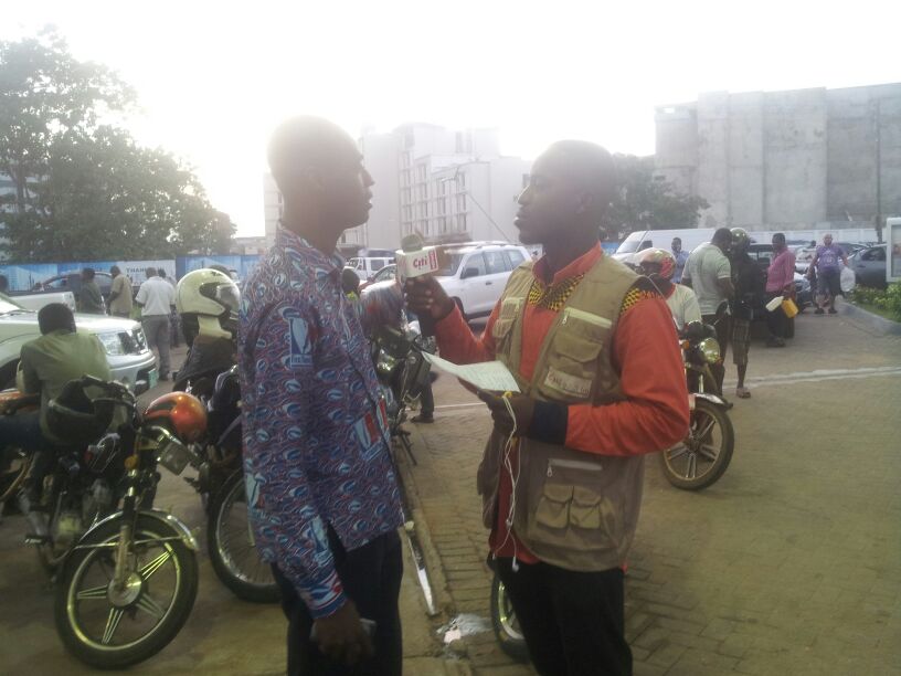 Kojo Akoto Boateng speaking to a motorist