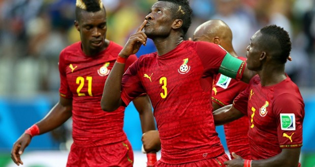 Asamoah Gyan (C) of Ghana celebrates scoring