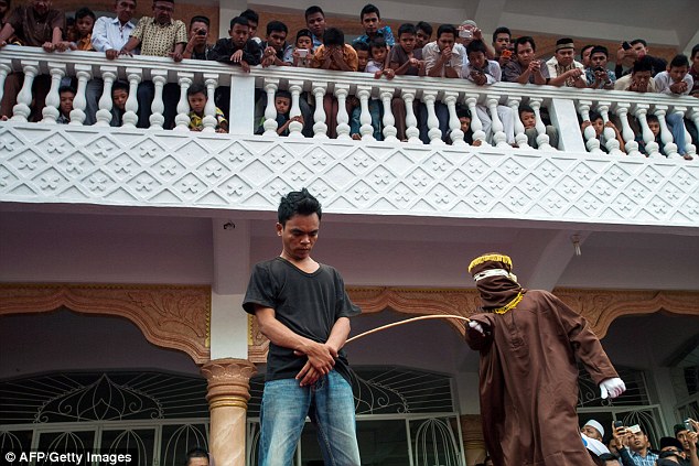 Eight convicted Indonesian gamblers caned in public